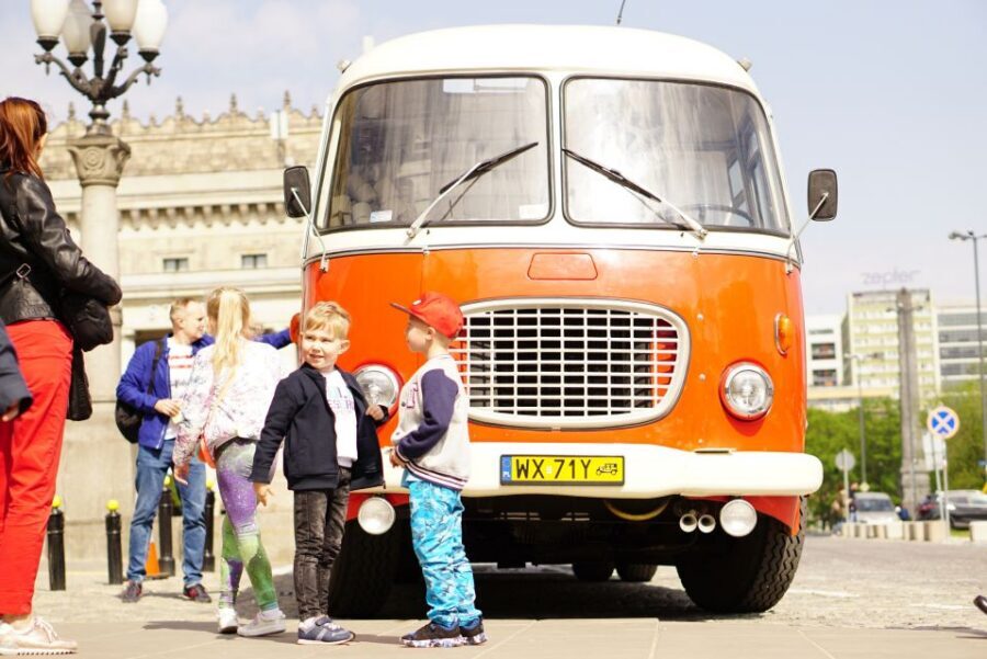 Warsaw: Highlights Guided Retro Bus Tour - Palace of Culture and Science (PKiN): the controversial starting point